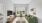 Large living area with green couch and large windows