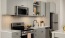 kitchen with gray cabinets and island