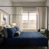 spacious bedroom with large window