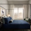spacious bedroom with large window