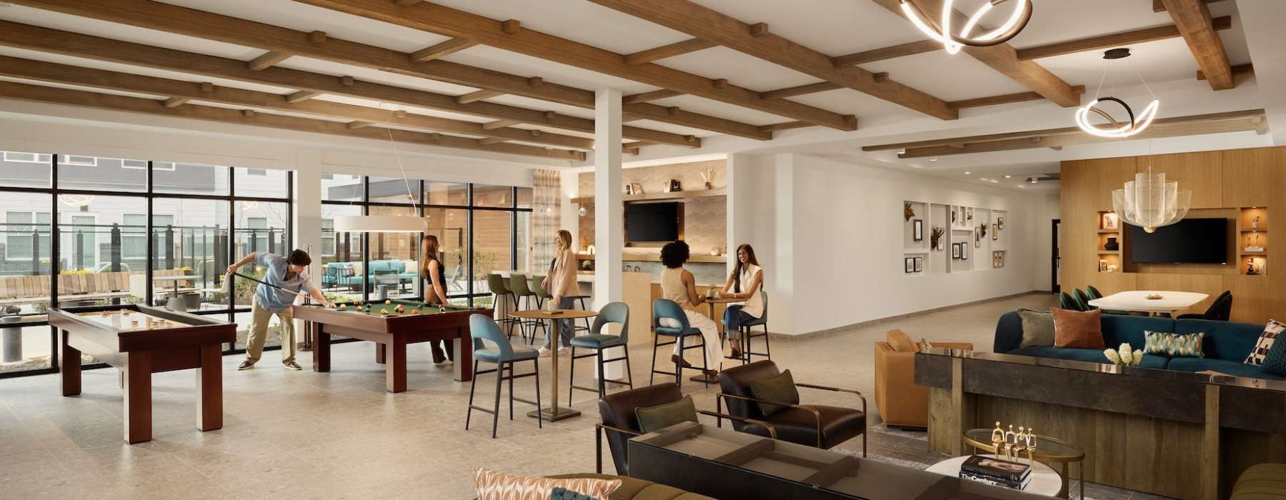 clubroom with pool tables and seating